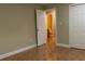 Bedroom boasts tile floors, closet, and access to a bathroom with a door, providing convenience at 2701 S Dellwood Dr, Eustis, FL 32726