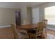 Dining room featuring tile flooring, neutral paint, and a wood table with chairs at 2701 S Dellwood Dr, Eustis, FL 32726