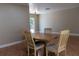 Dining room featuring tile flooring, neutral paint, and a wood table with chairs at 2701 S Dellwood Dr, Eustis, FL 32726