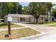 Charming single-story home with a well-maintained lawn and a spacious concrete driveway at 2701 S Dellwood Dr, Eustis, FL 32726