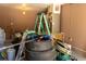 Cluttered residential garage featuring an air conditioner at 2701 S Dellwood Dr, Eustis, FL 32726