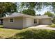 Attached single-car garage of a well-maintained single story home with a concrete driveway at 2701 S Dellwood Dr, Eustis, FL 32726