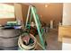 A cluttered residential garage with an open door at 2701 S Dellwood Dr, Eustis, FL 32726