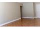 Living room featuring tile flooring, neutral paint, and an entry door to the exterior at 2701 S Dellwood Dr, Eustis, FL 32726