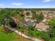 Aerial view of neighborhood showcasing tree-lined streets, well-maintained lawns, and attractive homes at 2712 Plainridge Loop, The Villages, FL 32162