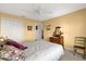 Bedroom with carpet, traditional furnishings, ceiling fan, and a double door closet at 2712 Plainridge Loop, The Villages, FL 32162