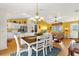 Open-concept dining and living areas with a view of the kitchen at 2712 Plainridge Loop, The Villages, FL 32162