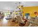 Bright living room with modern furniture and a view of the kitchen at 2712 Plainridge Loop, The Villages, FL 32162