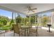 Screened-in porch with a ceiling fan, outdoor furniture, and views of the backyard at 2712 Plainridge Loop, The Villages, FL 32162