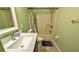 Bathroom with tiled floor, quartz countertop vanity, toilet, and tub and shower at 2718 Lorraine Dr, Leesburg, FL 34748