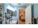This bathroom features a sink, mirror, and decor, with a peek of a bedroom in the background at 2718 Lorraine Dr, Leesburg, FL 34748
