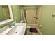 Bathroom with tiled floor, quartz countertop vanity, toilet, and tub and shower at 2718 Lorraine Dr, Leesburg, FL 34748