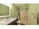 Bathroom featuring tiled floors, vanity sink, toilet, and shower-tub combination at 2718 Lorraine Dr, Leesburg, FL 34748