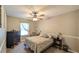 Bedroom featuring neutral walls, a ceiling fan, a window with curtains, and carpet at 2718 Lorraine Dr, Leesburg, FL 34748