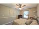 Neutral-toned bedroom featuring a ceiling fan, a window with curtains, and carpet at 2718 Lorraine Dr, Leesburg, FL 34748