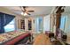 Cozy bedroom featuring a ceiling fan, and a connecting bathroom and walk-in closet at 2718 Lorraine Dr, Leesburg, FL 34748