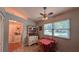 Cozy dining area features a charming hutch, bright windows, and a ceiling fan for comfortable dining at 2718 Lorraine Dr, Leesburg, FL 34748