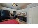 Modern kitchen featuring sleek black appliances, stylish two-tone cabinets, and ample counter space for meal prep at 2718 Lorraine Dr, Leesburg, FL 34748