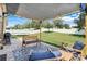 Back patio with sunshade, a bench and rocking chairs to enjoy the outdoors at 2889 Columbus Ave, Clermont, FL 34715