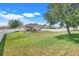 A lush backyard with a privacy fence, offering a serene outdoor space at 2889 Columbus Ave, Clermont, FL 34715
