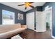 Bedroom featuring hardwood floors, ceiling fan, closet, and natural light at 2889 Columbus Ave, Clermont, FL 34715