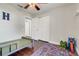 bedroom featuring ceiling fan, neutral walls, hardwood floors and closet at 2889 Columbus Ave, Clermont, FL 34715