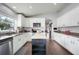 Well-designed kitchen with white cabinets, granite counters, a dark wood island, and stainless appliances at 2889 Columbus Ave, Clermont, FL 34715