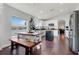 Bright kitchen features white cabinets, dark hardwood floors, and an island, creating a cozy atmosphere at 2889 Columbus Ave, Clermont, FL 34715