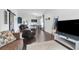 Stylish living room with hardwood floors, a sliding barn door, modern decor, and an open layout for entertaining at 2889 Columbus Ave, Clermont, FL 34715