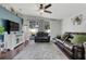 Bright living room showcasing a large sliding glass door to outdoor patio and a plush grey rug, perfect for relaxing at 2889 Columbus Ave, Clermont, FL 34715