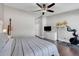 Cozy main bedroom with high ceilings, hardwood floors, exercise equipment, and modern decor for relaxation at 2889 Columbus Ave, Clermont, FL 34715