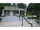 Exterior view of pool house with comfortable seating and lush landscaping at 2889 Columbus Ave, Clermont, FL 34715