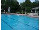 Relaxing pool view with poolside loungers and sunshade at 2889 Columbus Ave, Clermont, FL 34715