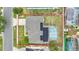 Backyard view of a home featuring a screened-in pool with solar panels on the roof at 2896 Picadilly Cir, Kissimmee, FL 34747
