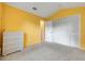 A cozy bedroom with a large closet and dresser, perfect for storage at 2896 Picadilly Cir, Kissimmee, FL 34747