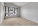 Bright bedroom with neutral carpet, vaulted ceiling, and large window dressed with patterned curtains at 2896 Picadilly Cir, Kissimmee, FL 34747