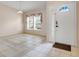 Entryway with neutral paint, tile flooring, and a door with decorative glass at 2896 Picadilly Cir, Kissimmee, FL 34747