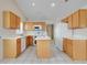 Eat-in kitchen boasting matching appliances, an island, and tile flooring for a clean, modern look at 2896 Picadilly Cir, Kissimmee, FL 34747