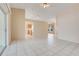 Open living space featuring tile flooring, views of the kitchen, and sliding glass doors to the outdoors at 2896 Picadilly Cir, Kissimmee, FL 34747