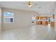Living space with vaulted ceilings, tile flooring, and ample natural light from the surrounding windows at 2896 Picadilly Cir, Kissimmee, FL 34747