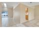 Open-concept living room with tile flooring, bright natural light, and easy access to outdoor spaces at 2896 Picadilly Cir, Kissimmee, FL 34747
