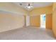 Spacious main bedroom with vaulted ceilings and en-suite bathroom access offering natural light at 2896 Picadilly Cir, Kissimmee, FL 34747