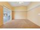 Bright main bedroom featuring sliding glass doors leading to an outdoor space at 2896 Picadilly Cir, Kissimmee, FL 34747