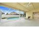 Relaxing screened-in patio with a ceiling fan overlooking the sparkling backyard pool at 2896 Picadilly Cir, Kissimmee, FL 34747