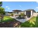 Relaxing backyard patio setup with outdoor seating and a grill, perfect for entertaining at 2928 Marlberry Ln, Clermont, FL 34714