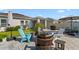 Paver patio features comfortable seating around a fire pit, perfect for entertaining and enjoying the outdoors at 2928 Marlberry Ln, Clermont, FL 34714