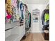 Walk-in closet with custom shelving, drawers, and ample hanging space for organized storage and convenience at 2928 Marlberry Ln, Clermont, FL 34714