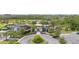 Exterior shot of the community clubhouse with palm trees and manicured landscaping at 2928 Marlberry Ln, Clermont, FL 34714