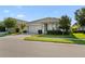 Single-story home with a two-car garage, a well-kept lawn, and landscaping at 2928 Marlberry Ln, Clermont, FL 34714