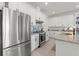 Bright kitchen featuring stainless steel appliances, granite countertops, and ample storage for organized cooking at 2928 Marlberry Ln, Clermont, FL 34714